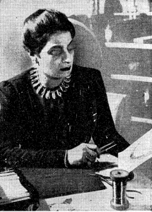 Marie El-Khoury, 1940. She is surrounded by the tools of her trade and wearing a necklace of her own design.